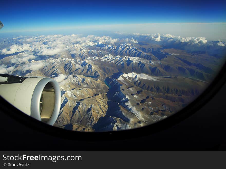 Top view of Tiansan mountain range from airplane window in clear sunny day, Xinjiang, China. Top view of Tiansan mountain range from airplane window in clear sunny day, Xinjiang, China