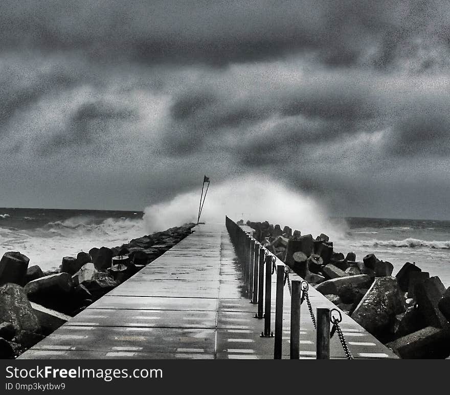 Black and white picture of Stormy Weather at the pier