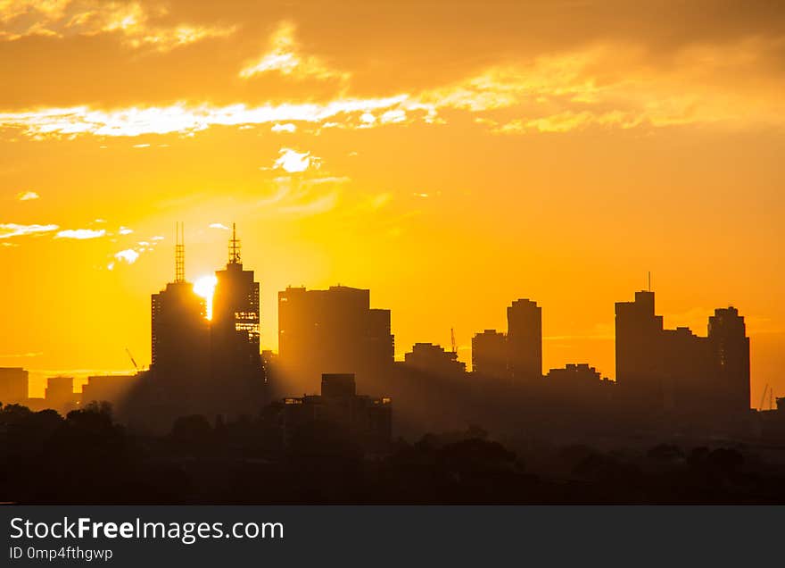 Sunset through Melbourne`s CBD buildings. Sunset through Melbourne`s CBD buildings