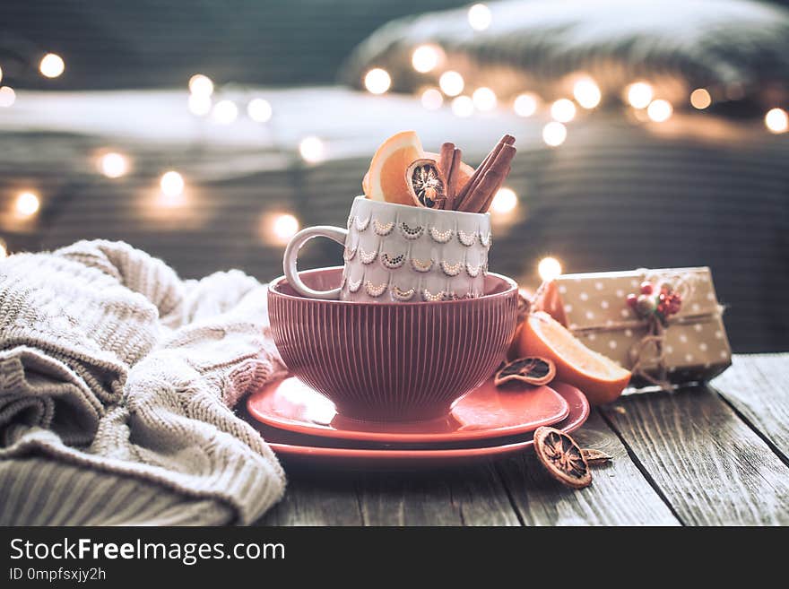 Still life with home Christmas decor in the living room on a wooden table, the concept of celebration and home comfort. Still life with home Christmas decor in the living room on a wooden table, the concept of celebration and home comfort