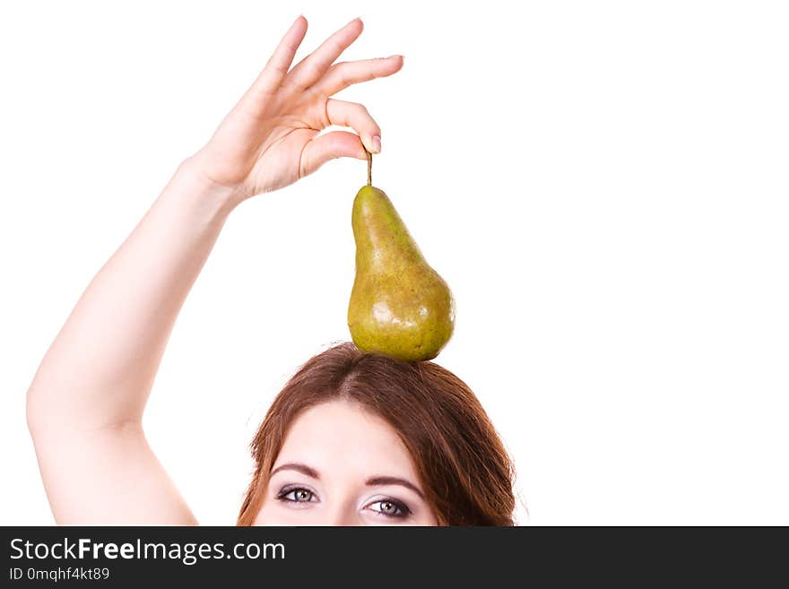 Woman holding on her head green pear fruit, recommend detox fruit diet, isolated on white. Healthy dieting, vegan food, vitamins immunity concept. Woman holding on her head green pear fruit, recommend detox fruit diet, isolated on white. Healthy dieting, vegan food, vitamins immunity concept.