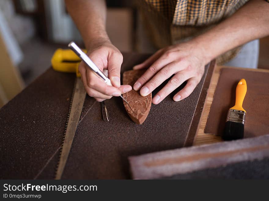 A Joiner Using His Chisel