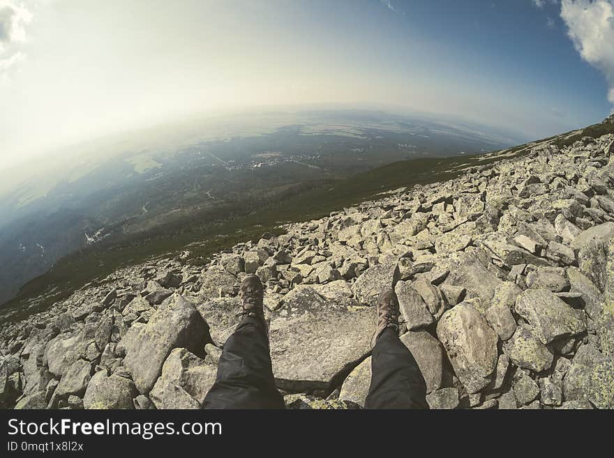 rocky sharp mountain tops in Tatra mountains in Slovakia with clouds and mist from above and rain clouds. Rysy mountain. - vintage retro look. rocky sharp mountain tops in Tatra mountains in Slovakia with clouds and mist from above and rain clouds. Rysy mountain. - vintage retro look