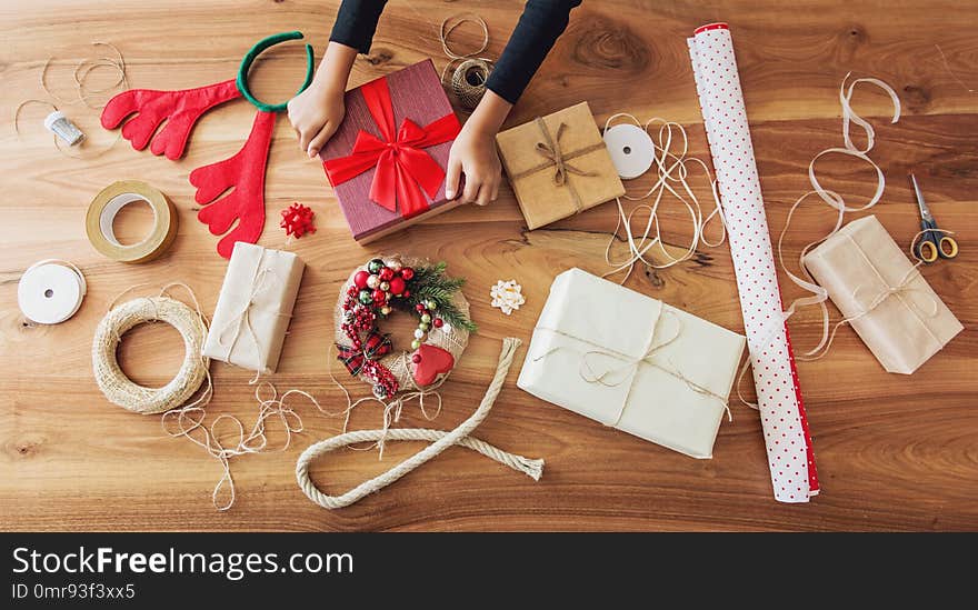 Christmas Presents And Gift Wrapping Equipment On The Table