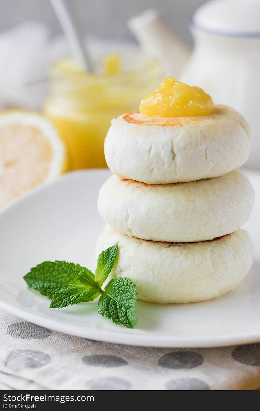 Cheese pancake on rice flour with lemon custard cream for breakfast on a light background. Cheese pancake on rice flour with lemon custard cream for breakfast on a light background