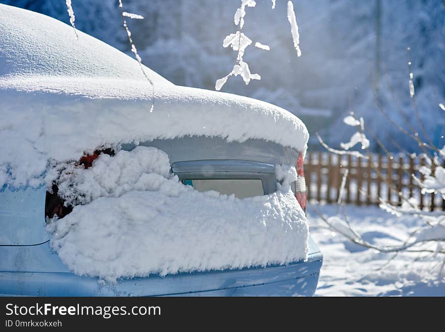 Fragment of car under layer of snow after heavy snowfall. Fragment of car under layer of snow after heavy snowfall