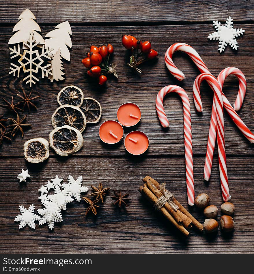 Christmas, New Year, DIY, holidays preparation and creativity concept. Getting ready to celebration. Festive decorations, spices, candy canes, flat lay. Christmas, New Year, DIY, holidays preparation and creativity concept. Getting ready to celebration. Festive decorations, spices, candy canes, flat lay