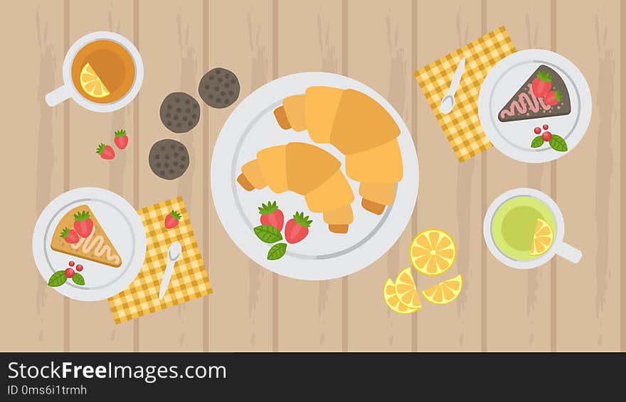 Croissants, cake and cookies on the table with tea, tea party