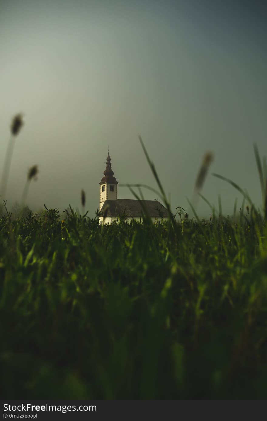 Picture of a church emerging from a morning fog in Slovenia, Bohinjska Bistrica. Picture of a church emerging from a morning fog in Slovenia, Bohinjska Bistrica.