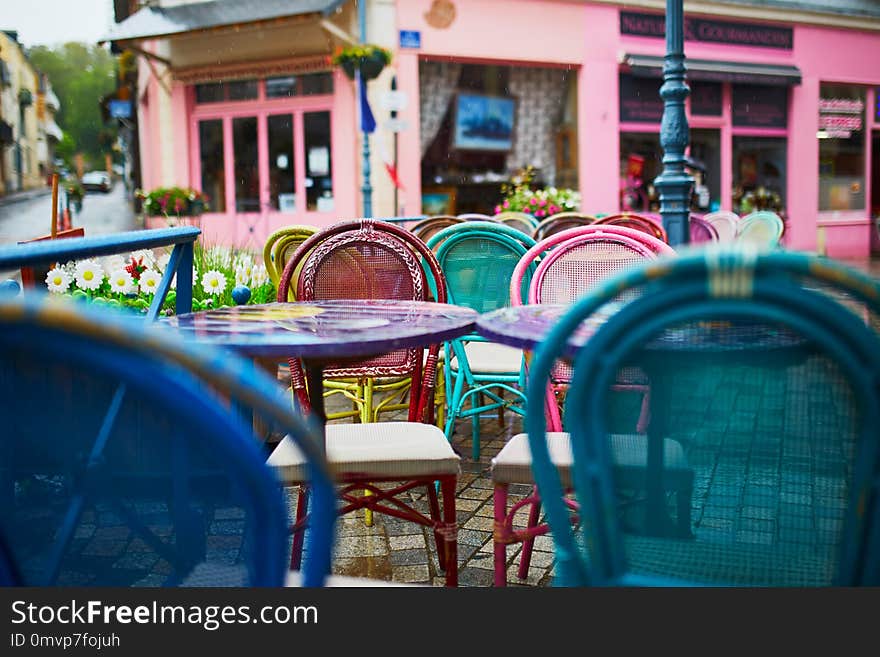 Colorful tables and chairs of a French cafe