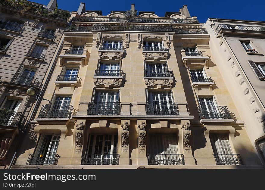 The typical facade of Parisian building, France. The typical facade of Parisian building, France.