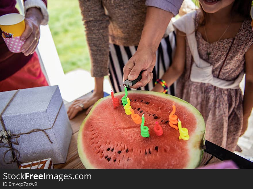 Close up of male hand that lighting the candles