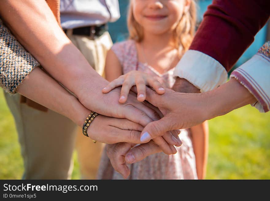 Close up of little hands that being on top