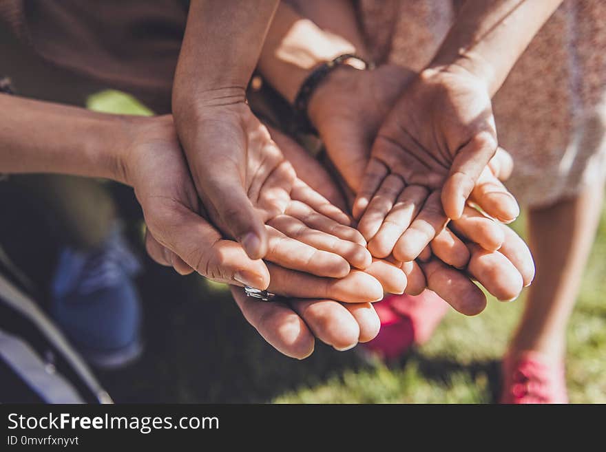 Family support. Strong men standing close to his relatives and showing his palms. Family support. Strong men standing close to his relatives and showing his palms