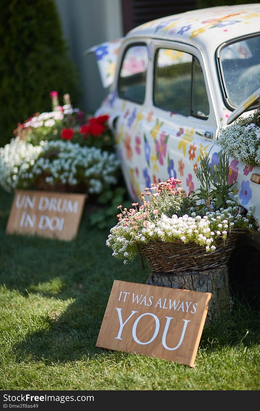 Car Painted With Flowers, Surrounded By Bouquets Of Flowers, Wedding Decor