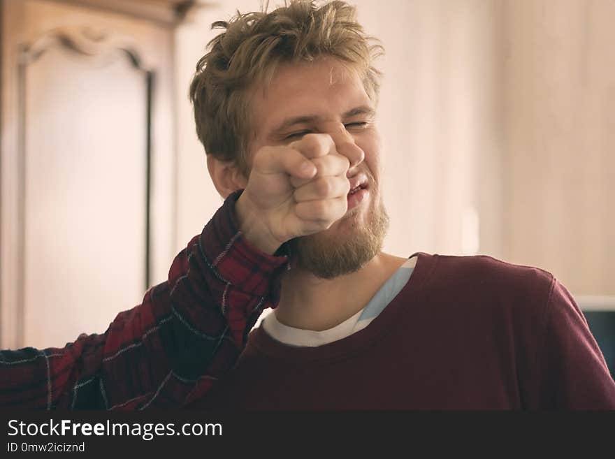 Two young men fight each other and punch fist in face close up f