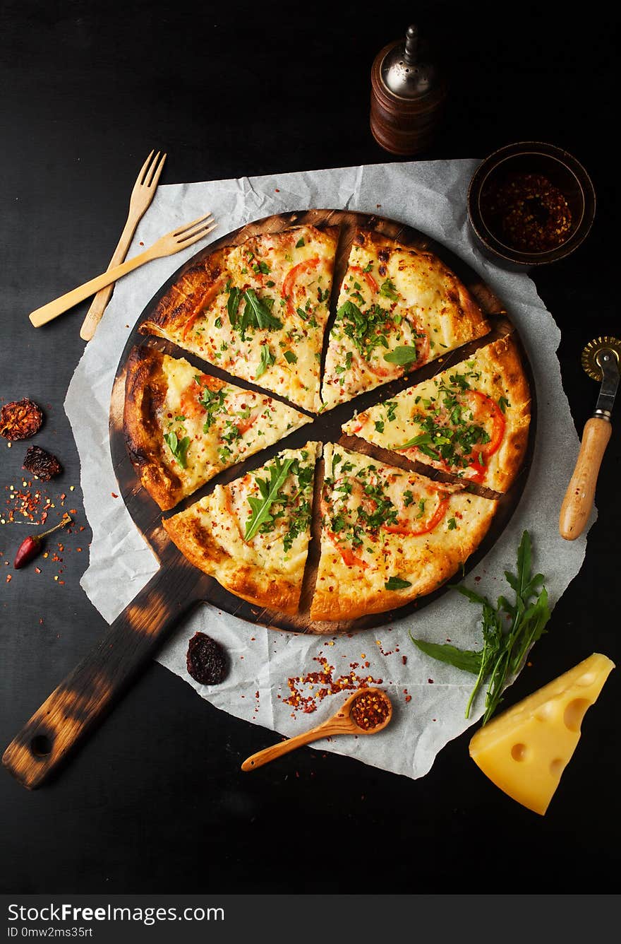 Delicious pizza margherita with arugula and basil