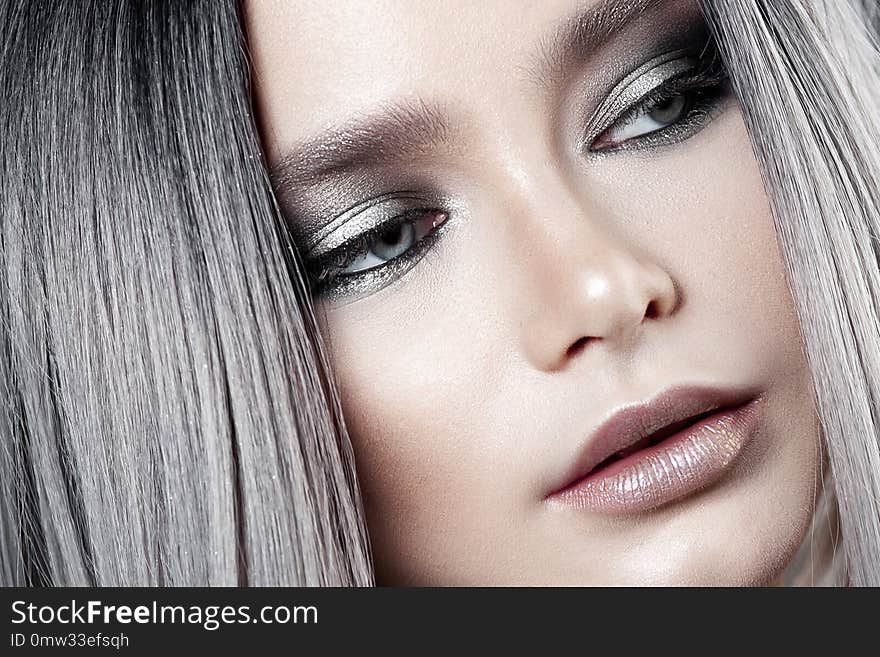 Young beautiful girl with silver make-up and ash hair. Beauty close-up portrait