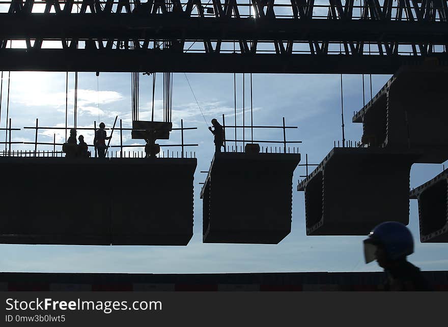 Silhouette tone. Concrete installation work at the project site. Silhouette tone. Concrete installation work at the project site