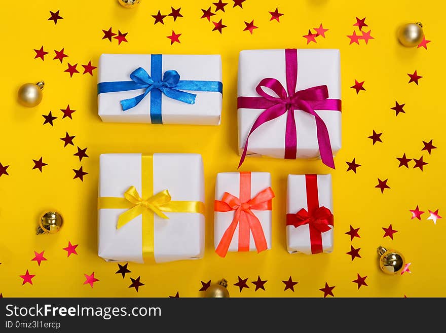 Flat lay composition with beautiful gift boxes on white background