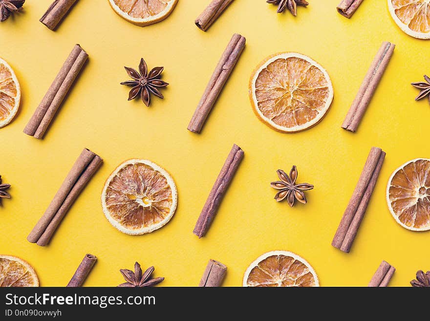 Spices or Mulled wine ingredients on yellow background. Top view, flat lay. Copy space for your text.