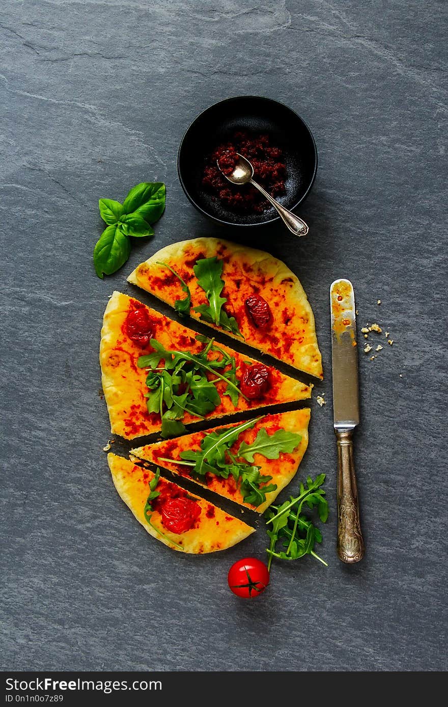 Homemade vegetarian pizza with vegetables and sun-dried tomato pesto flat-lay. Homemade vegetarian pizza with vegetables and sun-dried tomato pesto flat-lay