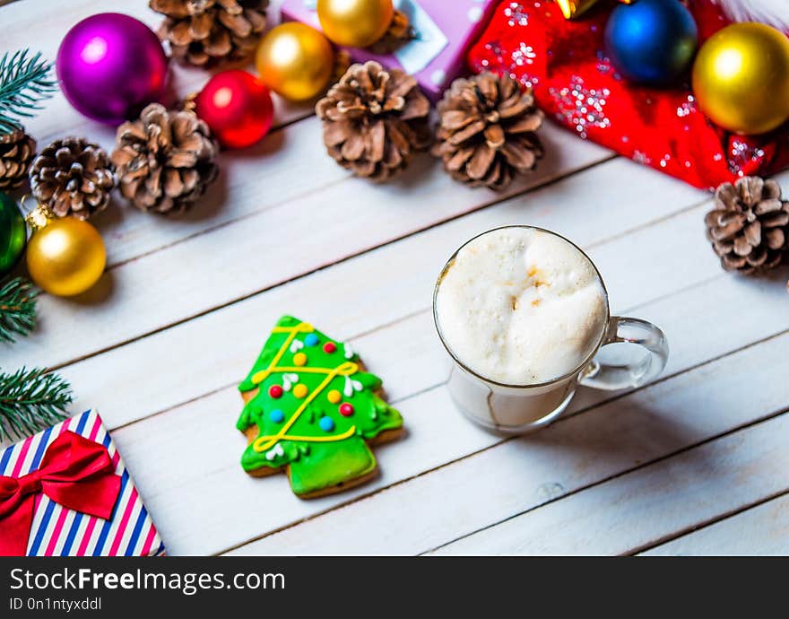 Christmas decorations, cookie and cup of coffee