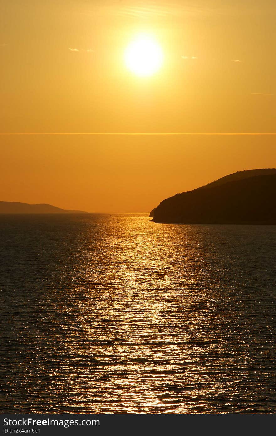 Orange Sunset in Adriatic Sea with Croatia coast skyline