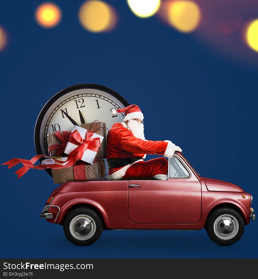 Christmas countdown arriving. Santa Claus on car delivering New Year gifts and clock at blue background. Christmas countdown arriving. Santa Claus on car delivering New Year gifts and clock at blue background