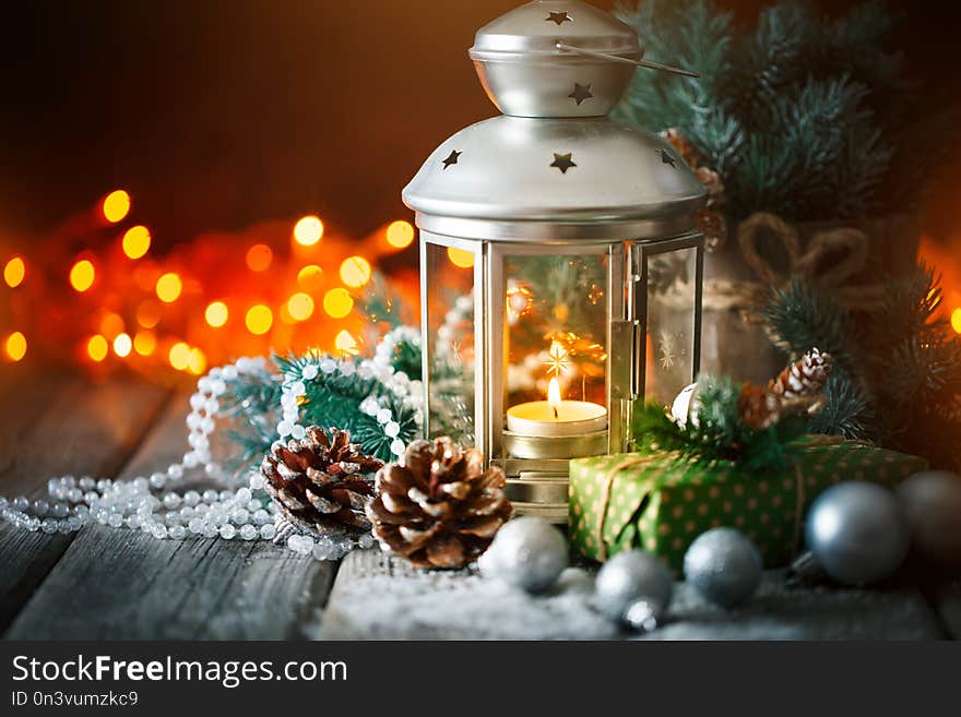 Merry Christmas and happy New year. Christmas gift and Christmas tree on dark wooden background. Selective focus.