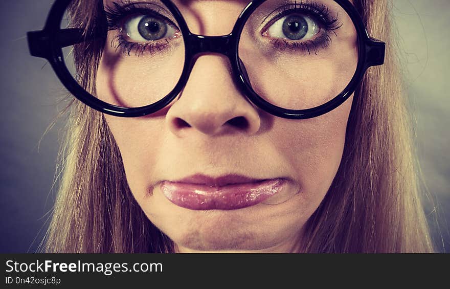 Closeup woman shocked face with eyeglasses