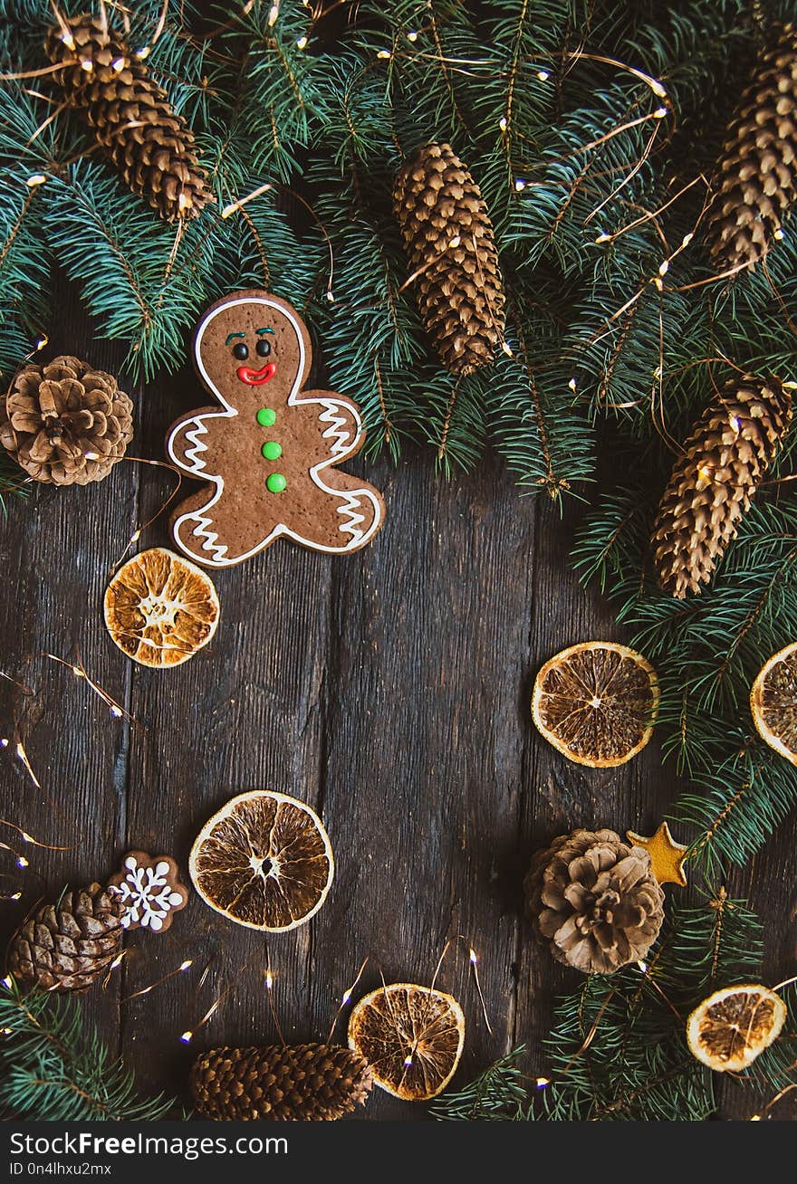 Gingerbread men laying on wood background. Christmas or New Year composition. copy space. Christmas or New Year composition. Christmas card
