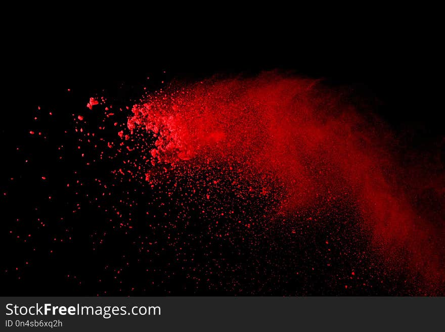 Abstract Red powder splatted background,Freeze motion of red powder exploding/throwing green dust.