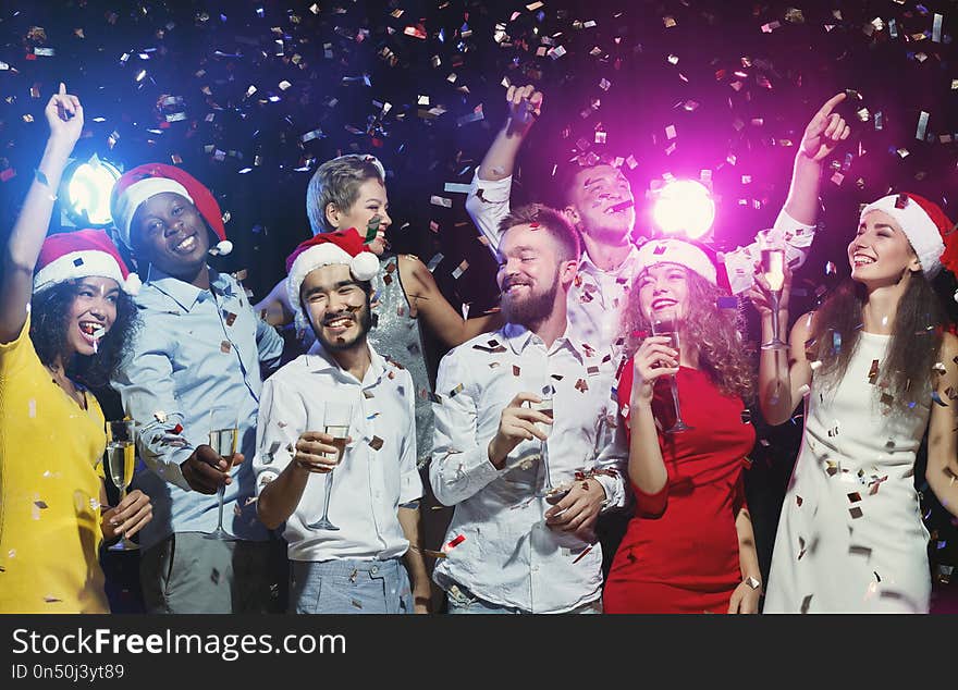 Happy friends dancing at New Year party