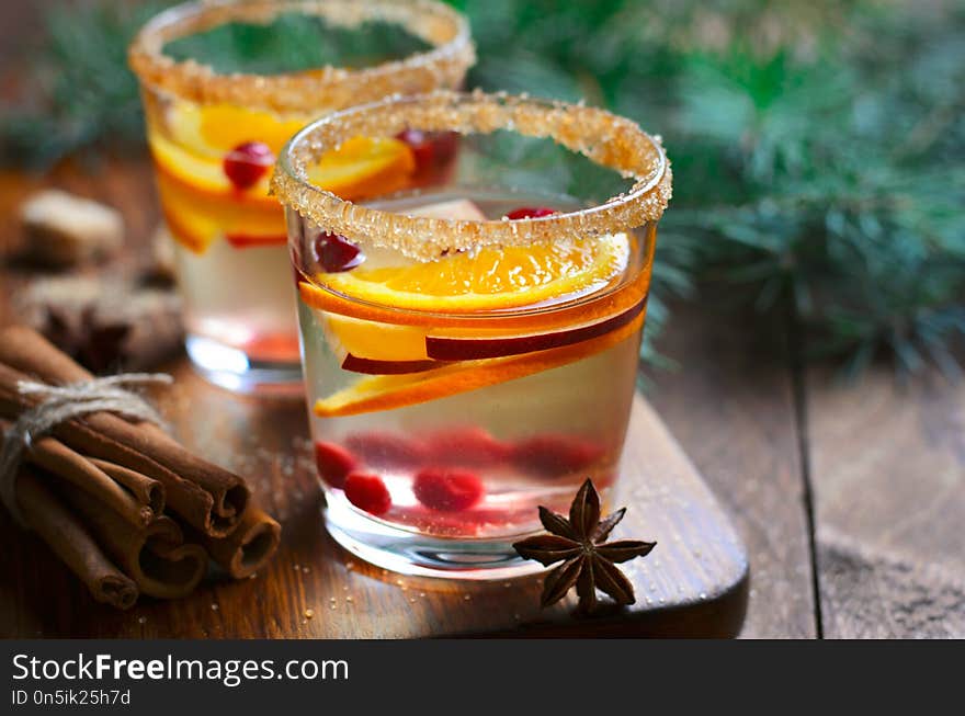 Winter Cocktail, Christmas Sangria with Apple Slices, Orange, Cranberry and Spices, Refreshing Drink