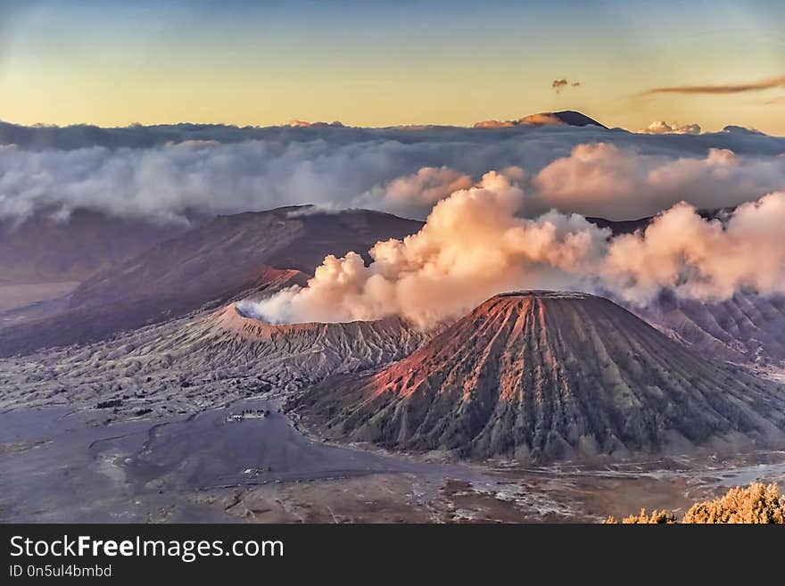 Mount Bromo sunrise with crater and cloudy misty morning view in high resolution image. Mount Bromo sunrise with crater and cloudy misty morning view in high resolution image