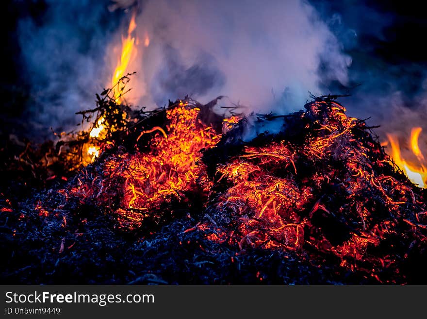 Fire and smoke during burning garbage. Pollution of the environment