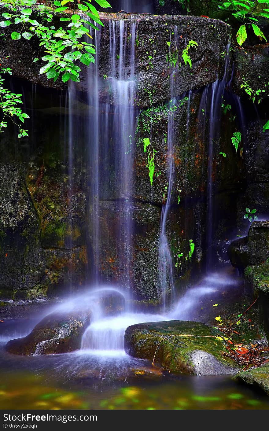 Beautiful waterfalls inside a cave in a tropical forest. Beautiful waterfalls inside a cave in a tropical forest.