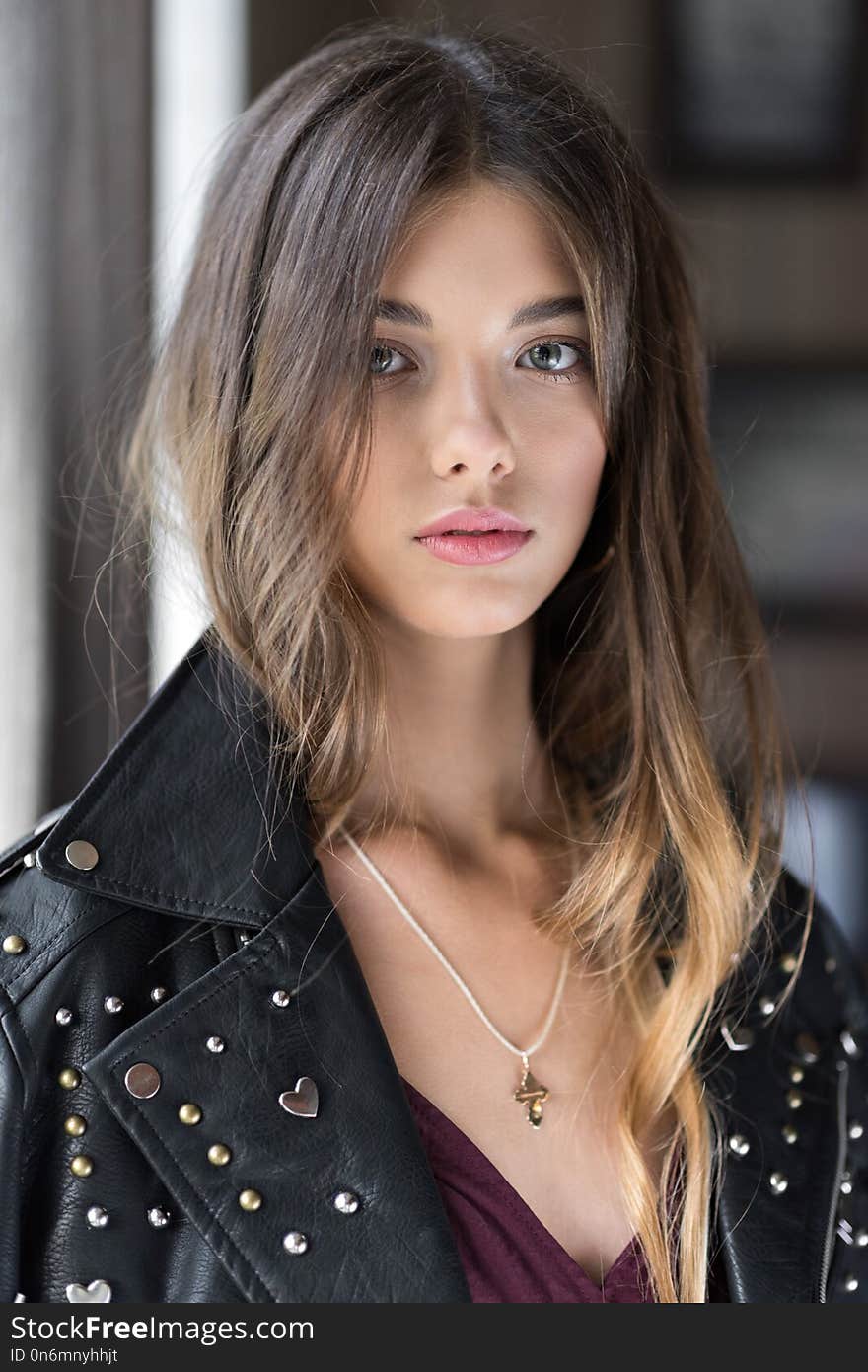 Beautiful, young girl in a fashionable dress in Marsala and leather jacket. The girl in the restaurant. Trend clothing. Without filters. Natural color. Beautiful, young girl in a fashionable dress in Marsala and leather jacket. The girl in the restaurant. Trend clothing. Without filters. Natural color.