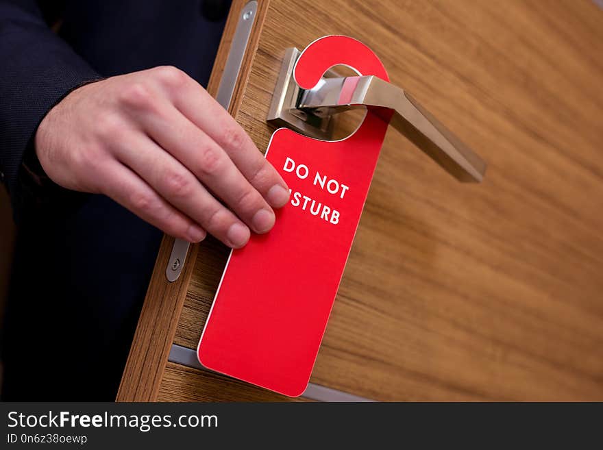 Do not disturb. Do not disturb sign hanging on the door in the hotel room