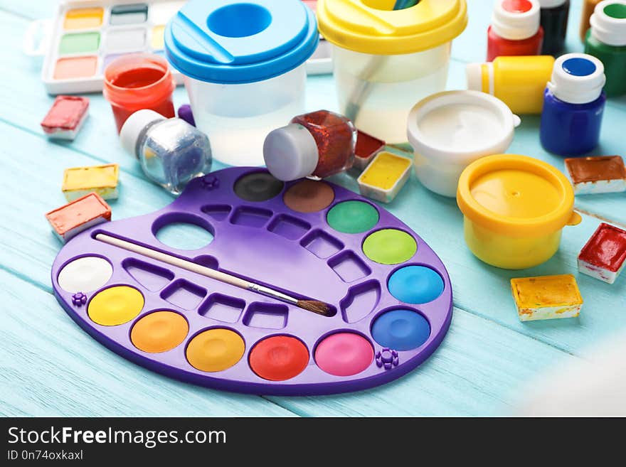 Set of painting materials for child on color table