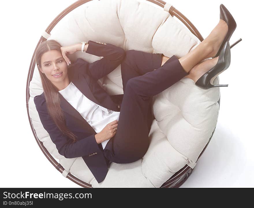 View from the top.closeup.young business woman thinking,sitting in a round chair