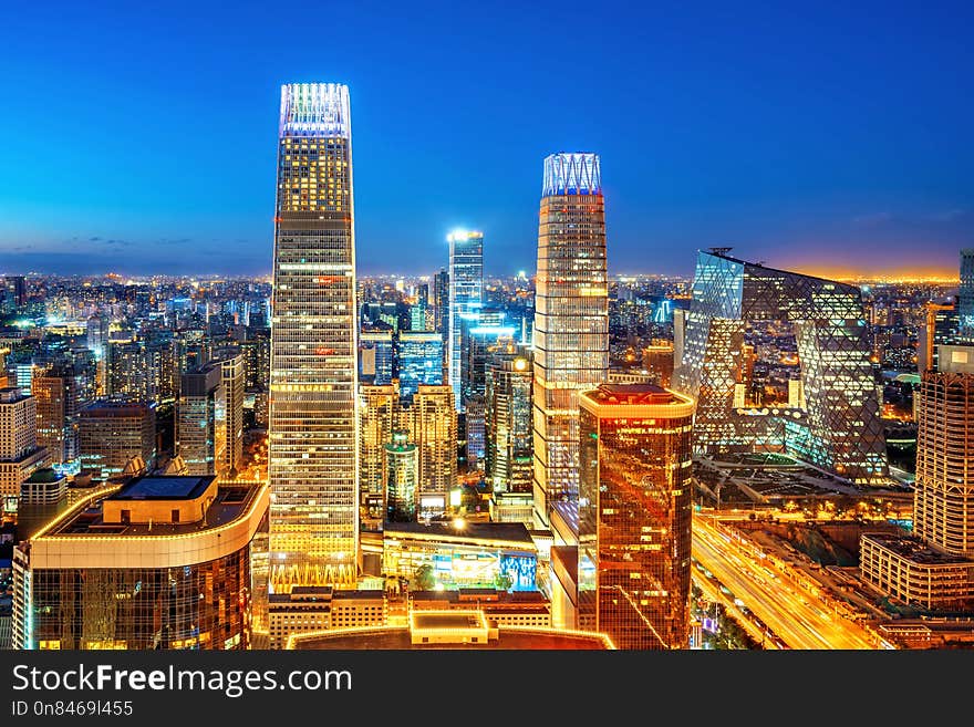 High-rise buildings and viaducts in the financial district of the city, night view of Beijing, China. High-rise buildings and viaducts in the financial district of the city, night view of Beijing, China.