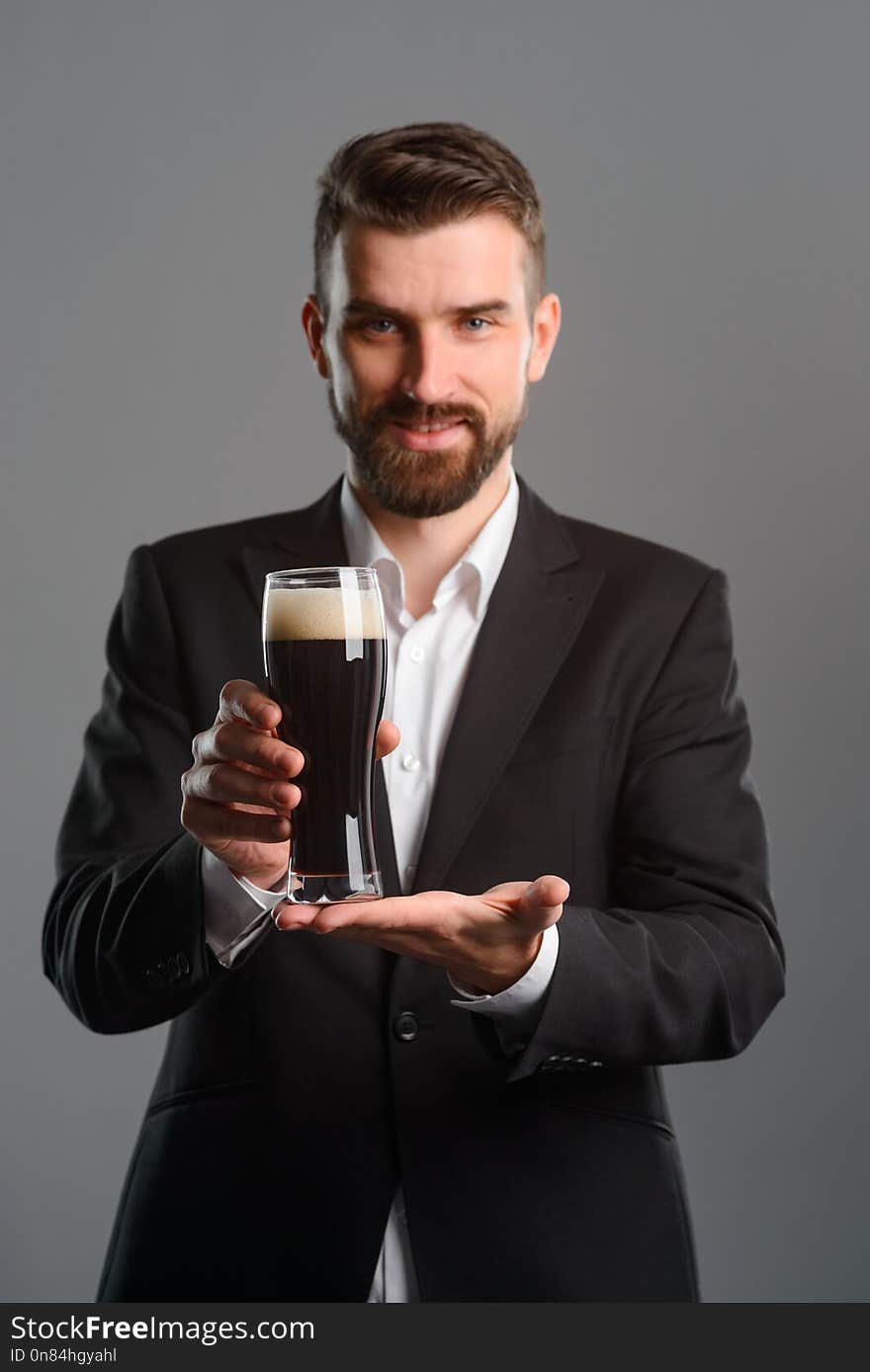 Young Man Showing Beer Glass