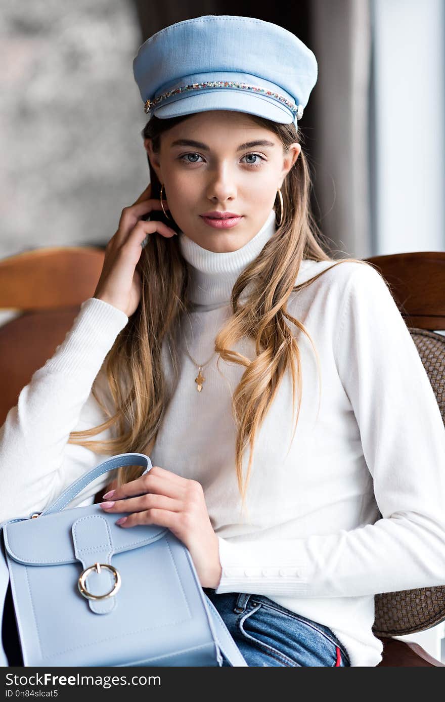 Photo of a beautiful girl in the interior of the restaurant