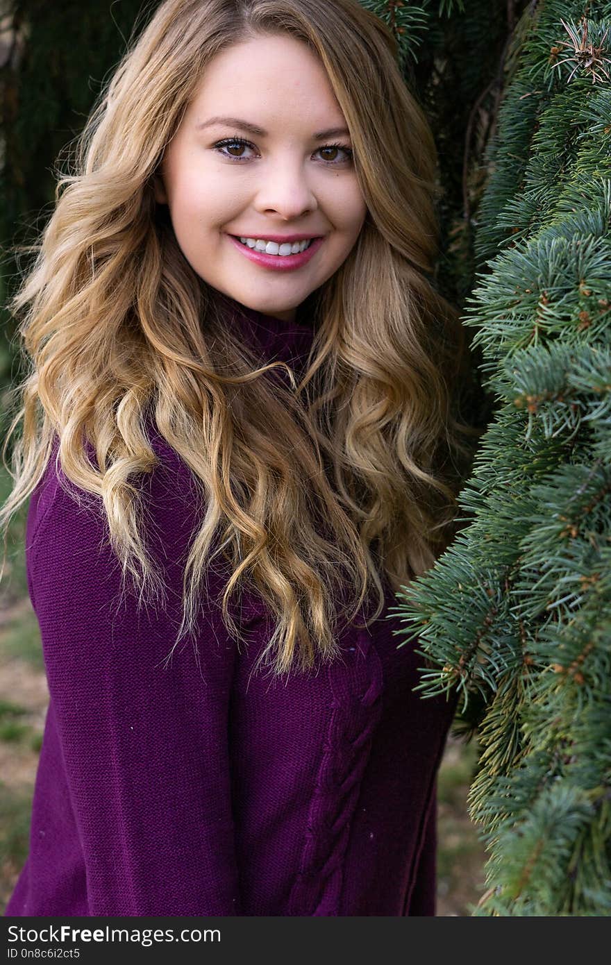 Pretty girl white latino with long blonde hair and curly curls wearing casual clothing for fall autumn fashion lifestyle.