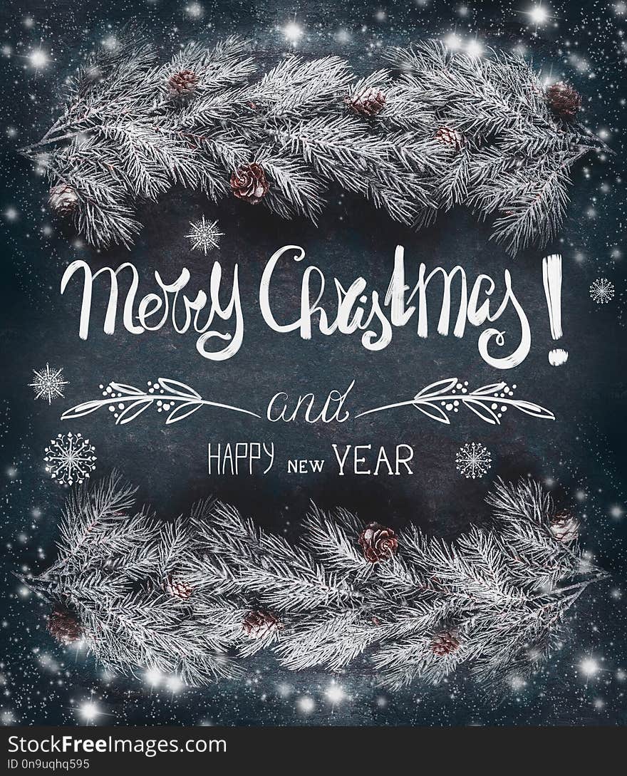 Winter Christmas greeting card with hoar and snow covered fir branches with cones and text lettering: Merry Christmas and Happy New Year on dark blue background