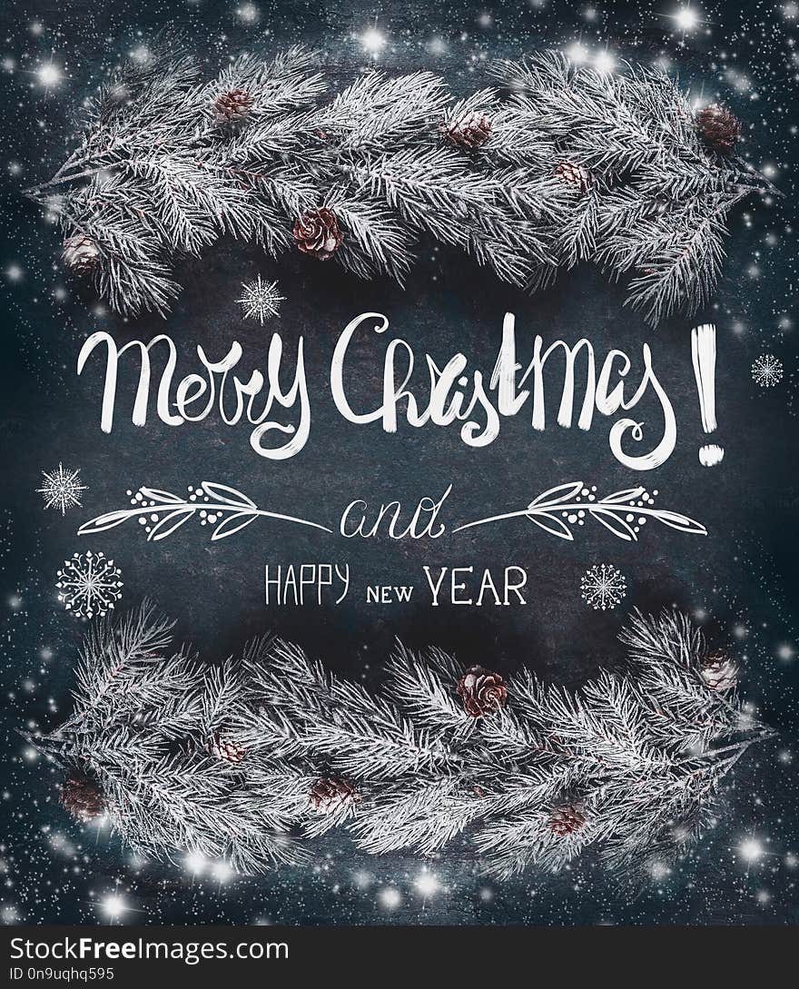 Christmas greeting card with hoar and snow covered fir branches with cones and text lettering: Merry Christmas and Happy New Year