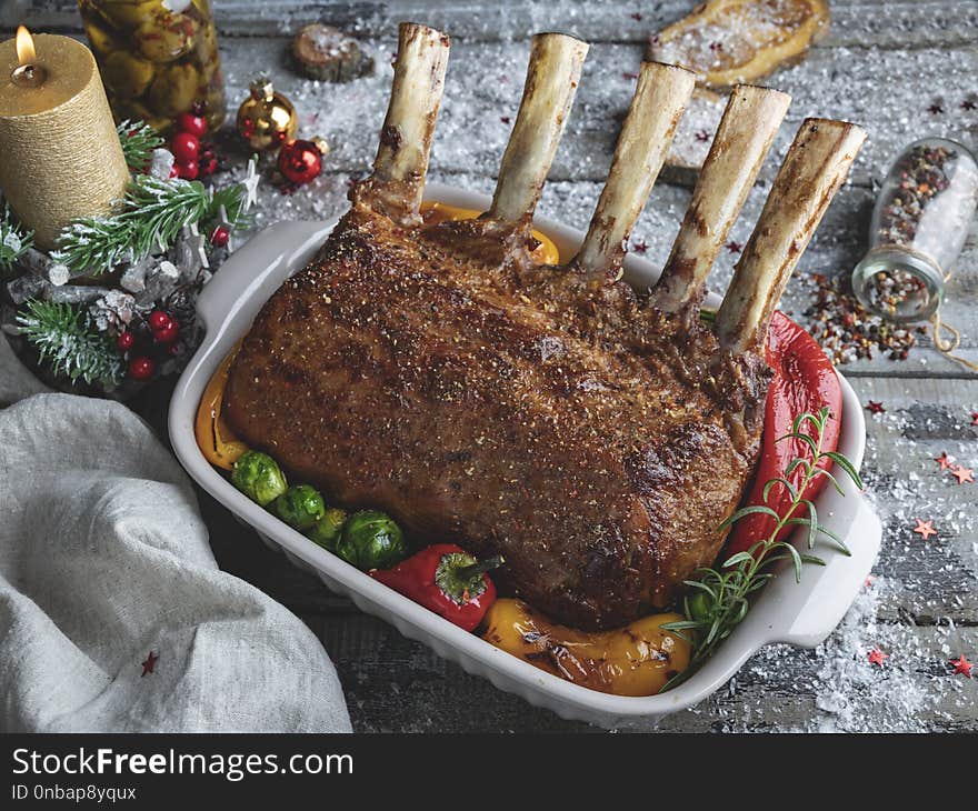 Grilled roasted rack of lamb,mutton with vegetables. New Year christmas composition,decoration.