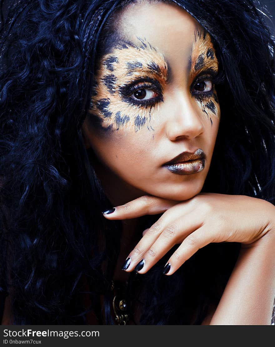 beauty afro girl with cat make up, creative leopard print closeu